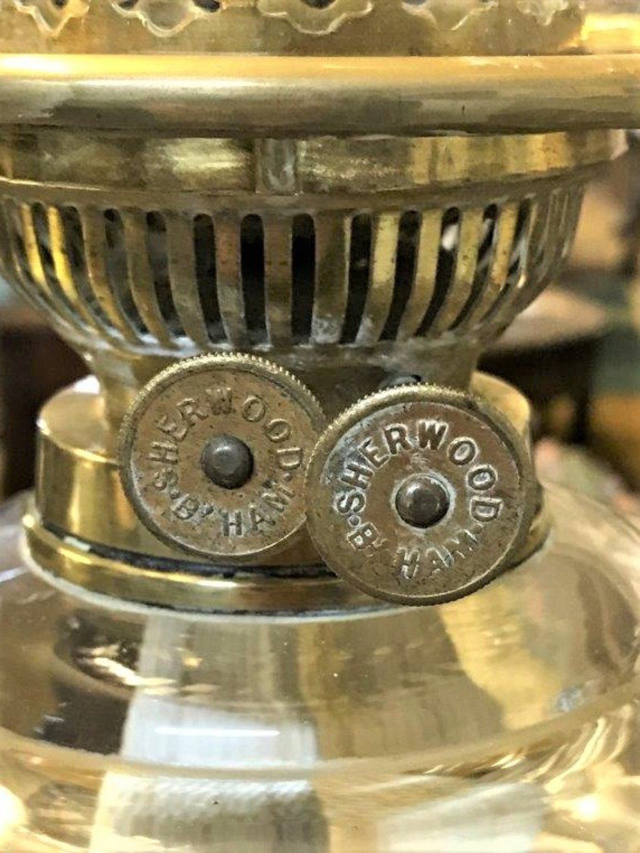 Antique Oil Lamp Faceted Glass Font Brass Repousse Column on a Circular Terracotta Glazed Plinth
