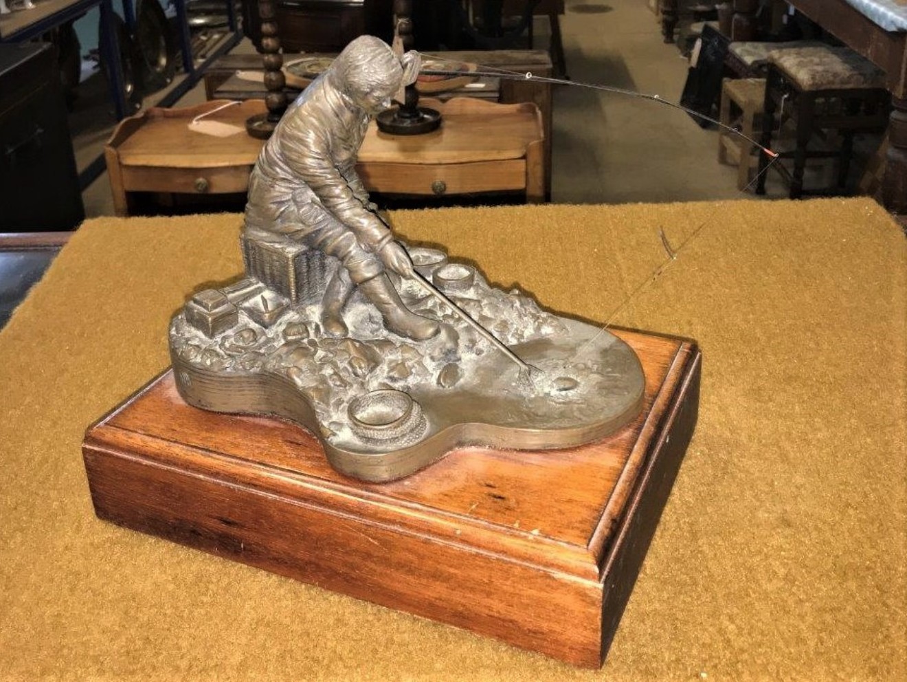 Bronze Effect Resin Sculpture of Fisherman Landing a Fish