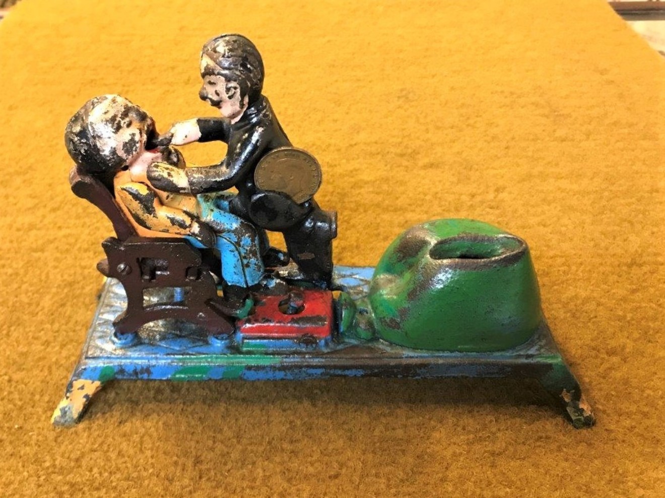 Vintage Cast Iron Penny Bank "Dentist Pulling Tooth"