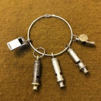 Vintage Collection of Whistles on Ring