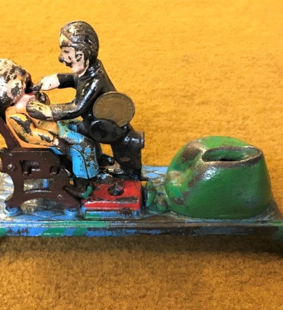 Vintage Cast Iron Penny Bank "Dentist Pulling Tooth"